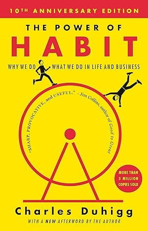 Book cover of The Power of Habit (10th Anniversary Edition) in bright yellow, with a red wheel and stick figures, by Charles Duhigg; subtitle on why habits drive life and business decisions.
