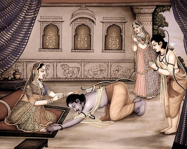 Ramayana-style painting of a blue-skinned prince prostrating at a seated queen's feet, while a bow-bearing companion and a maid stand nearby inside an ornate palace with carved panels.