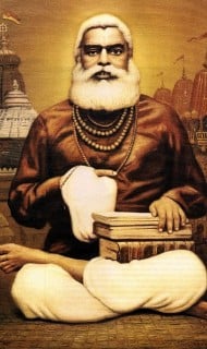 Illustrated portrait of an elderly bearded teacher seated cross-legged, holding prayer beads beside stacked scriptures, with temple spires behind, evoking study and congregational preaching articles.