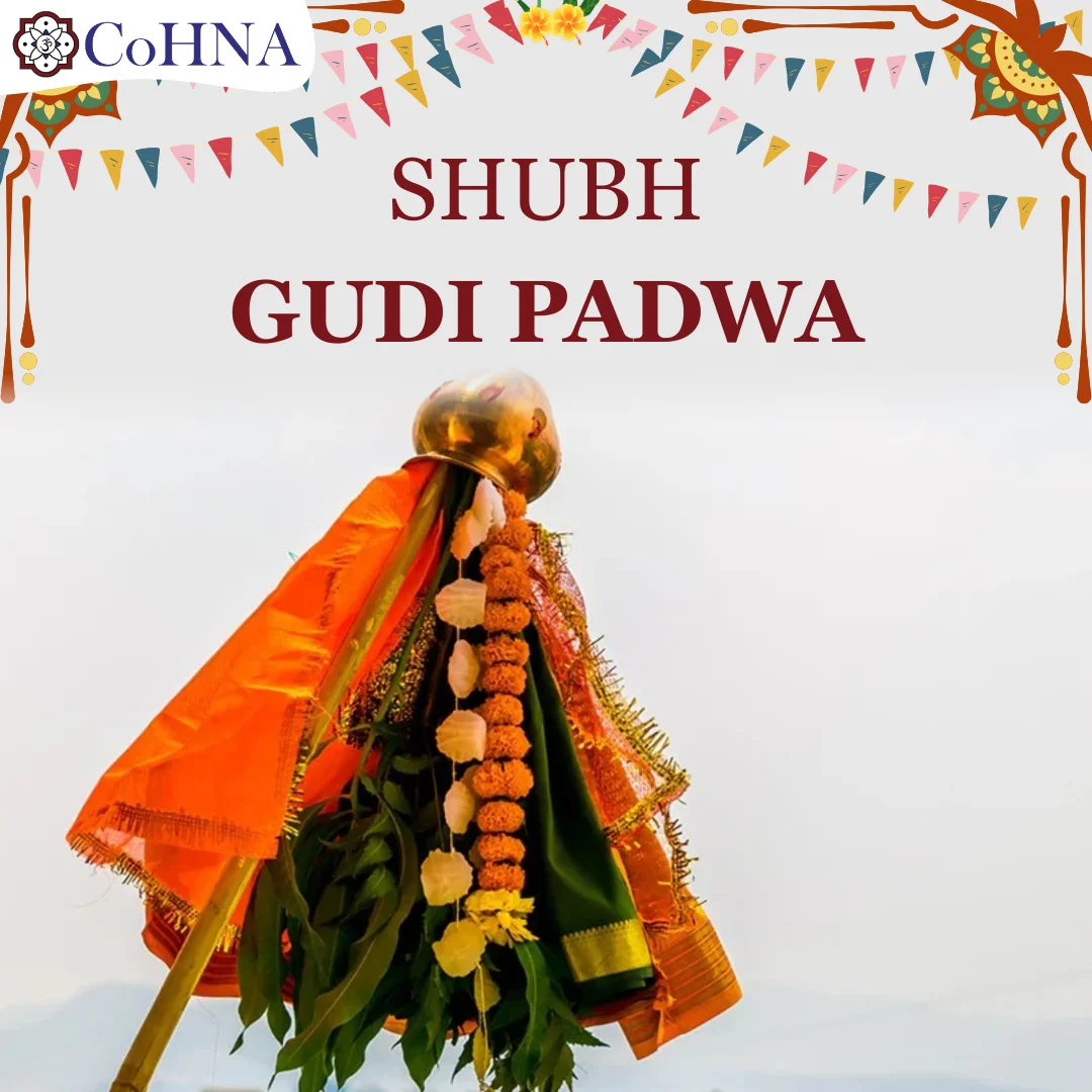 Decorated gudi for Gudi Padwa, the Hindu New Year festival: brass kalash on a bamboo pole draped in orange and green silk, with marigold and white garlands and mango leaves; festive bunting above.