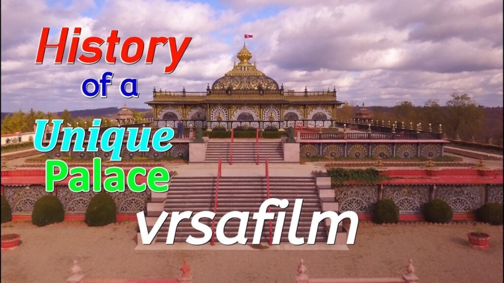 Aerial view of New Vrindaban's Palace of Gold, showing ornate black-and-gold facade, gilded dome, red stairways, and terrace gardens; overlay text reads History of a Unique Palace, testing.