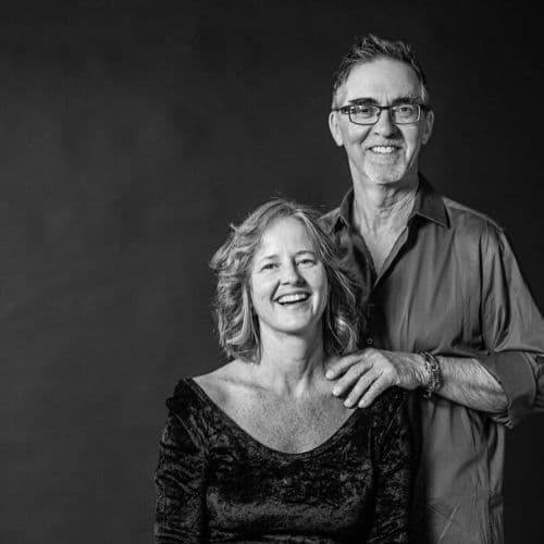 Black-and-white portrait of Planet Dharma teachers Catherine Pawasarat Sensei and Qapel Doug Duncan, reflecting Dharma community and awakening teachings.