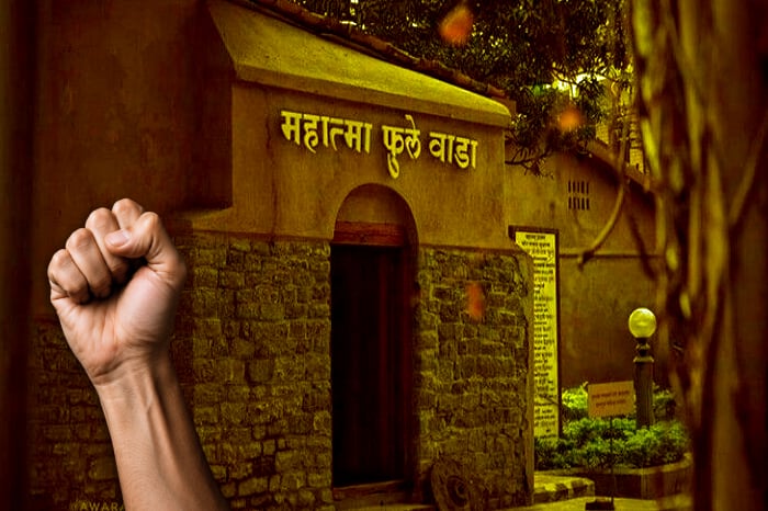 Raised fist before Mahatma Phule Wada in Maharashtra, symbolizing protest over alleged harassment faced by Hindu families in Bisur, Sangli.