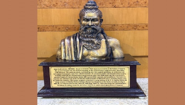 Bust of Maharshi Sushruta on a plinth with plaque, honoring Bharat's ancient surgeon and medical history in Health and History context.