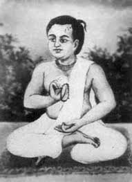 Black-and-white devotional portrait of young Sri Shyamananda Pandit seated cross-legged in meditation, linked to his disappearance day remembrance.