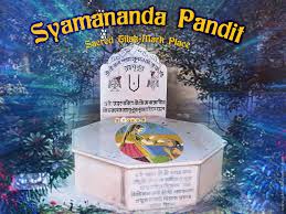 Memorial shrine labeled Syamananda Pandit Sacred Disappearance Place, shown amid trees for Shyamananda Pandit Disappearance remembrance