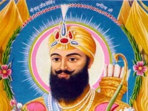 Colorful devotional illustration of a Sikh warrior figure with ornate turban, halo, beard, pearls, and weapons, relating to Nihang Singh identity.