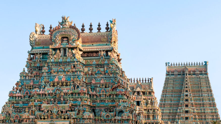 Ornate gopurams of Sri Ranganathaswamy Temple in Srirangam, Sri Rangam, showing colorful Vaishnava carvings and towering Dravidian architecture.