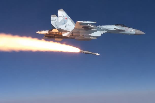 Sukhoi fighter jet launching an air-to-air missile over clear sky, illustrating Bharat Defence debate on PL-15 range gaps and long-range missiles