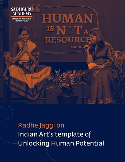 Radhe Jaggi seated at Sadhguru Academy's Human is Not a Resource event, linking classical arts, leadership, and unlocking human potential.