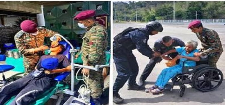 Indian doctors and uniformed relief workers treat patients at a mobile medical camp during Venezuela earthquake disaster relief in Caracas.