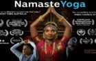 Namaste Yoga poster with a classical Indian dancer in prayer pose, festival laurels, and spiritual imagery linked to Dharma Seva content.