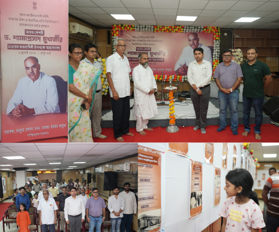 Diamond Harbour commemoration of Dr. Syama Prasad Mookerjee’s 125th birth anniversary with speakers, lamp lighting, audience, and exhibition panels.