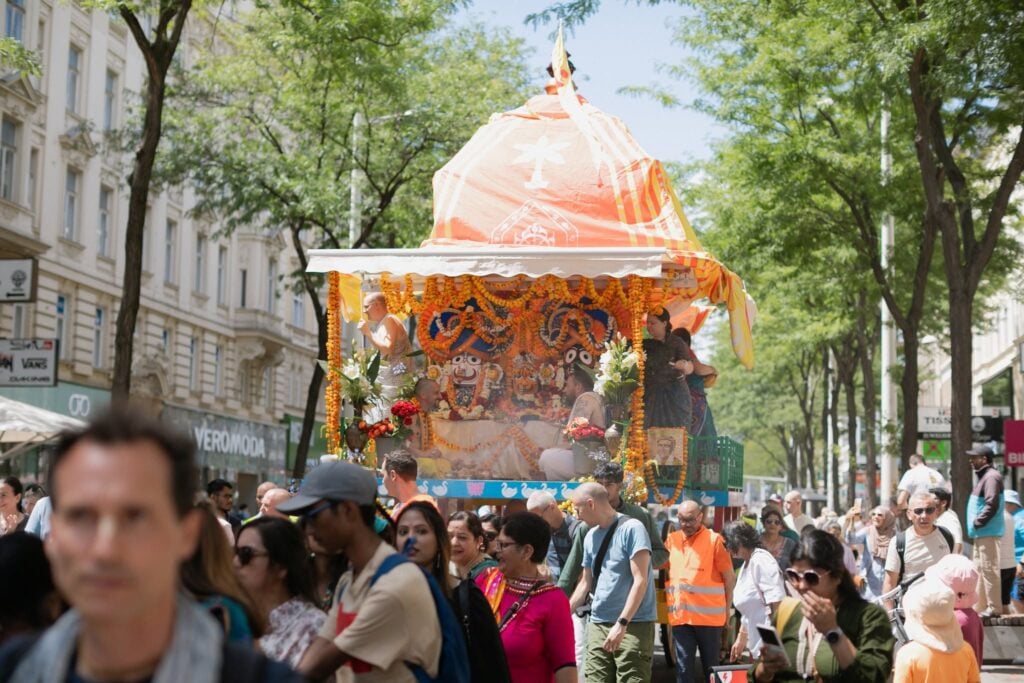 Decorated Jagannath chariot moves through a crowded Vienna street during the Ratha Yatra 2026 festival by ISKCON Vienna devotees