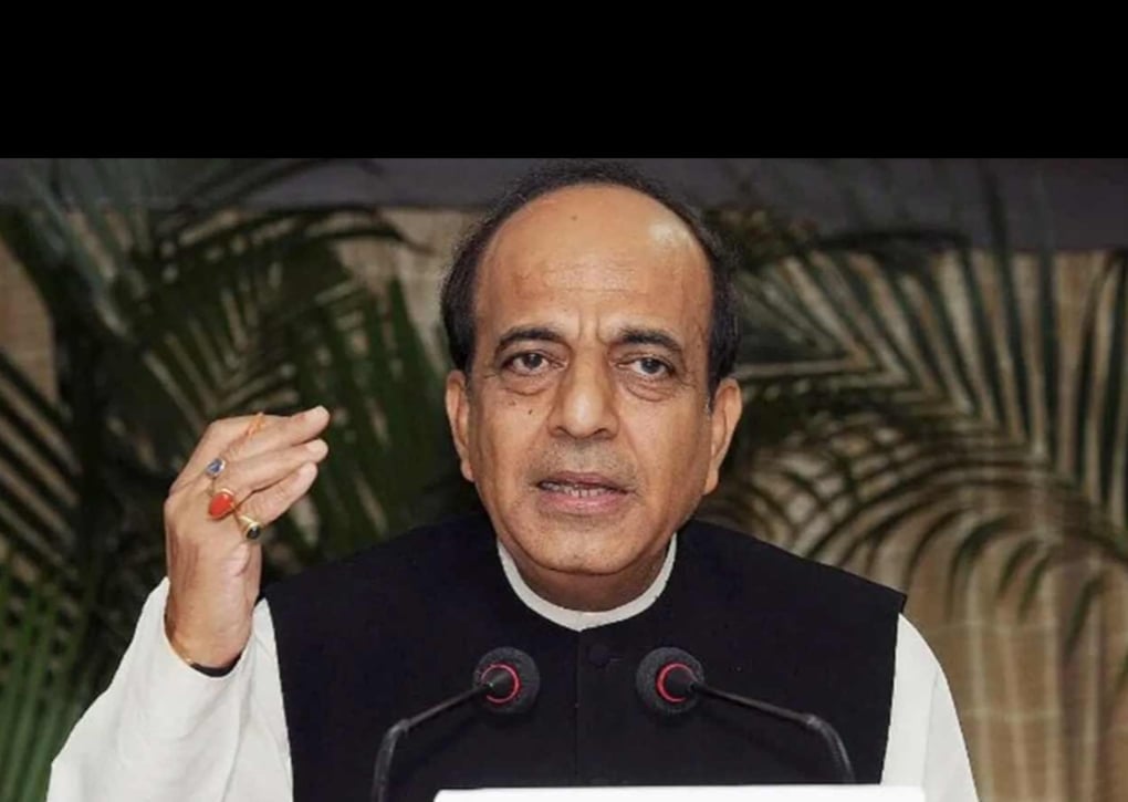 Dinesh Trivedi speaks at a lectern, raising one hand beside two microphones, in an image accompanying coverage of Bangladesh–India relations.