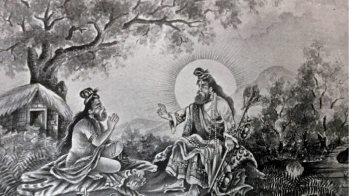 Black-and-white illustration of a haloed Hindu guru teaching a seated disciple beside a river, with a thatched hut, trees and hills in the background.