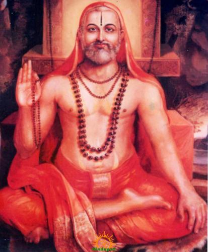 Devotional painting of Guru Raghavendra Swamy seated cross-legged in saffron robes, wearing prayer beads and raising his right hand in blessing at Mantralayam.