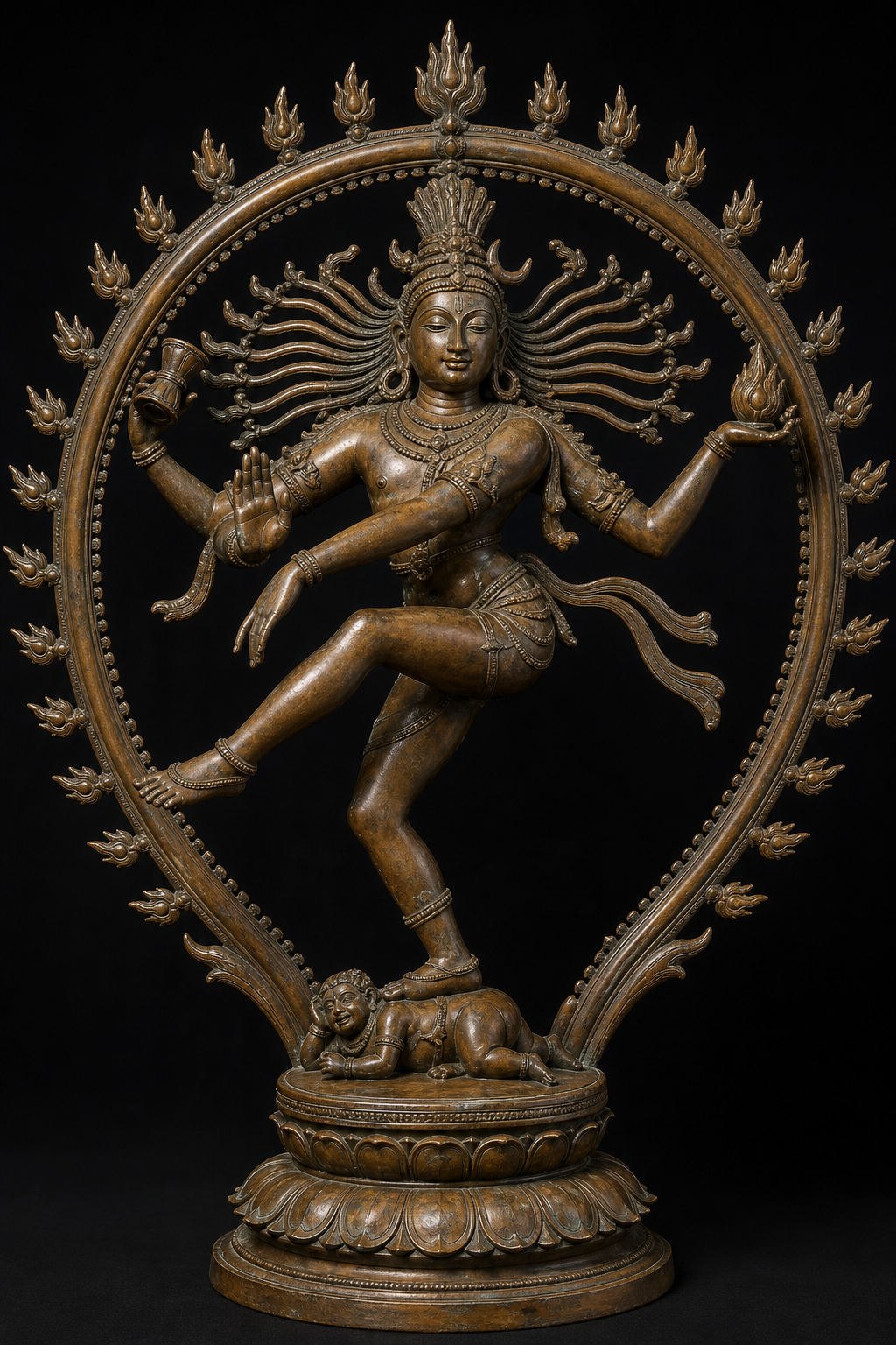 Full iconographic view of Nataraja showing the flaming ring, drum, fire, reassuring hand, cross-body arm, raised foot, and Apasmara beneath the planted foot.