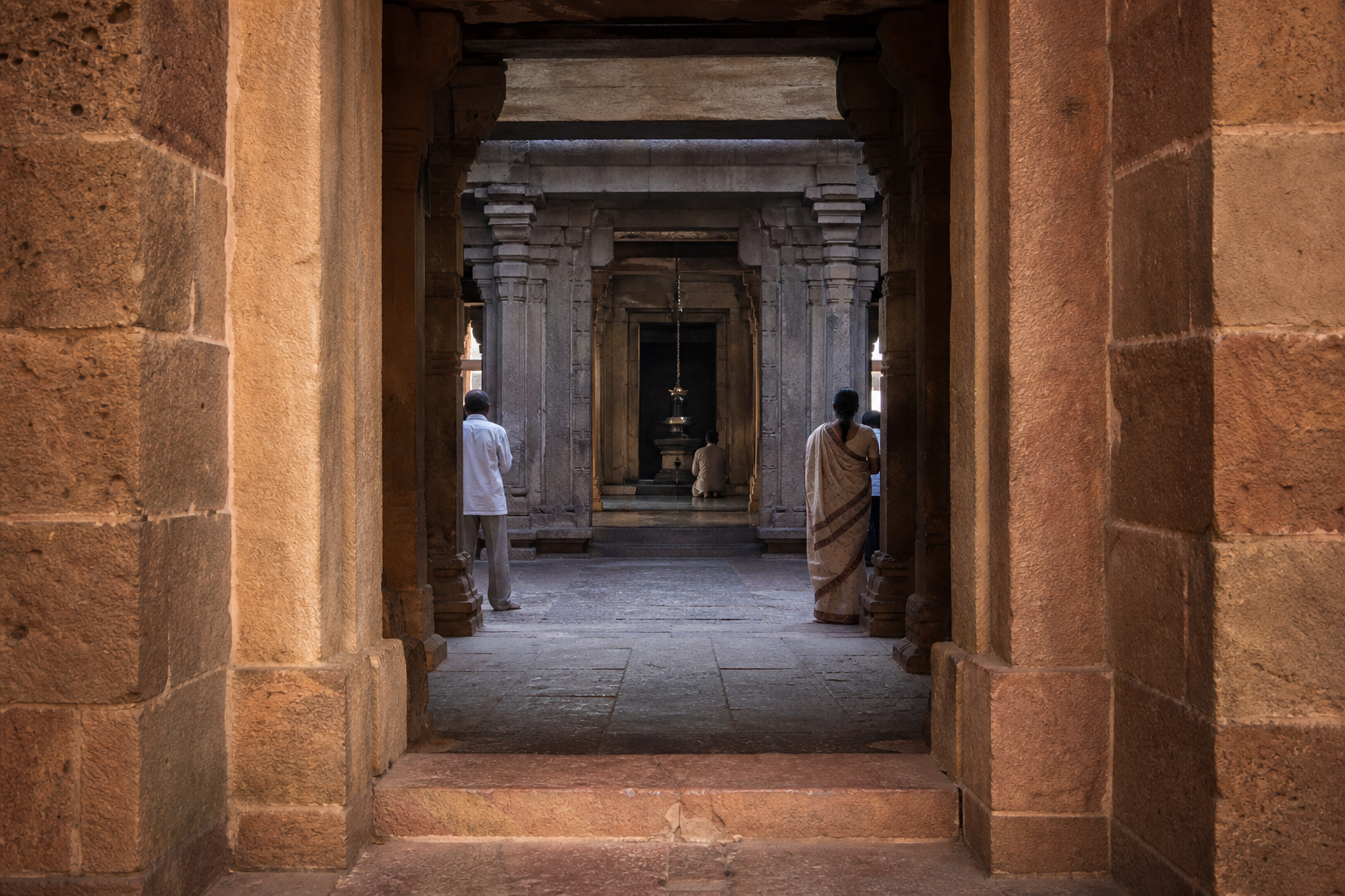 The sandstone doorway and interior spaces of Matangeshwar Temple align toward the shadowed central sanctum.