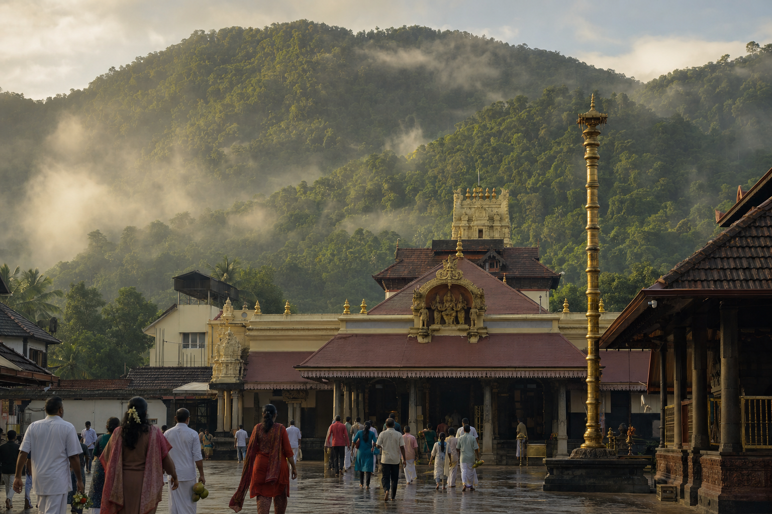 Pilgrims approach the Kukke Subramanya temple complex with misty, forested Western Ghats slopes behind the shrine roofs.