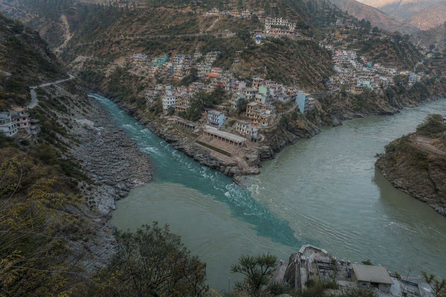 High-angle view of Nandprayag where the Nandakini River meets the Alaknanda River below the Himalayan town.