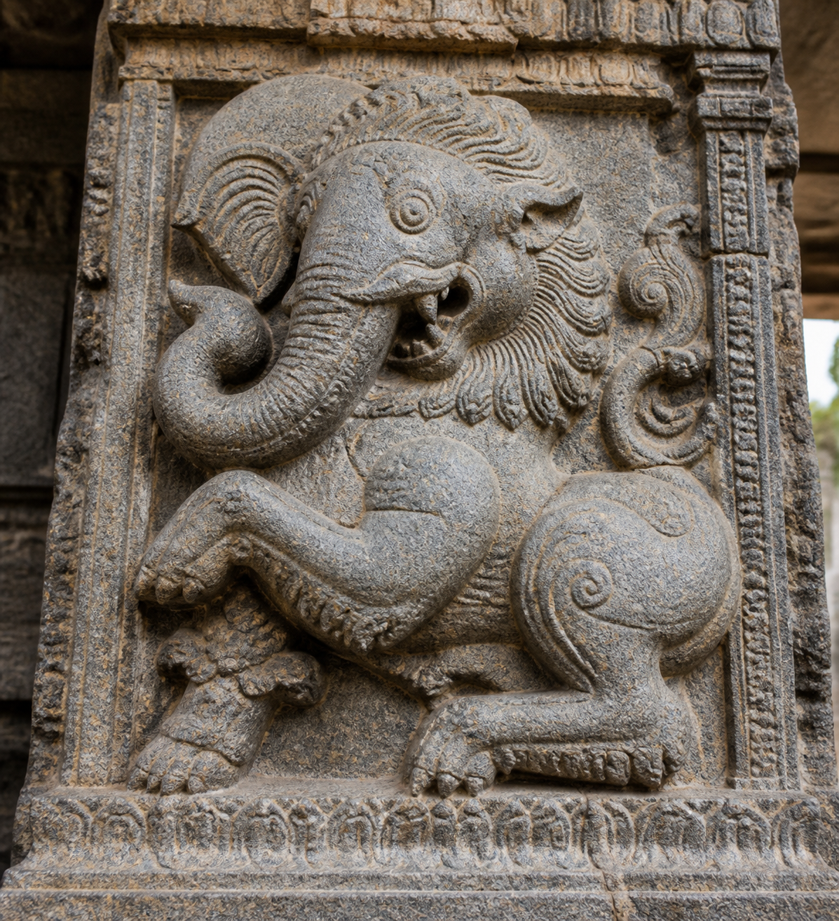 Close view of a stone composite creature with an elephantine trunk, broad ears, leonine jaws, mane, and clawed forelimbs.