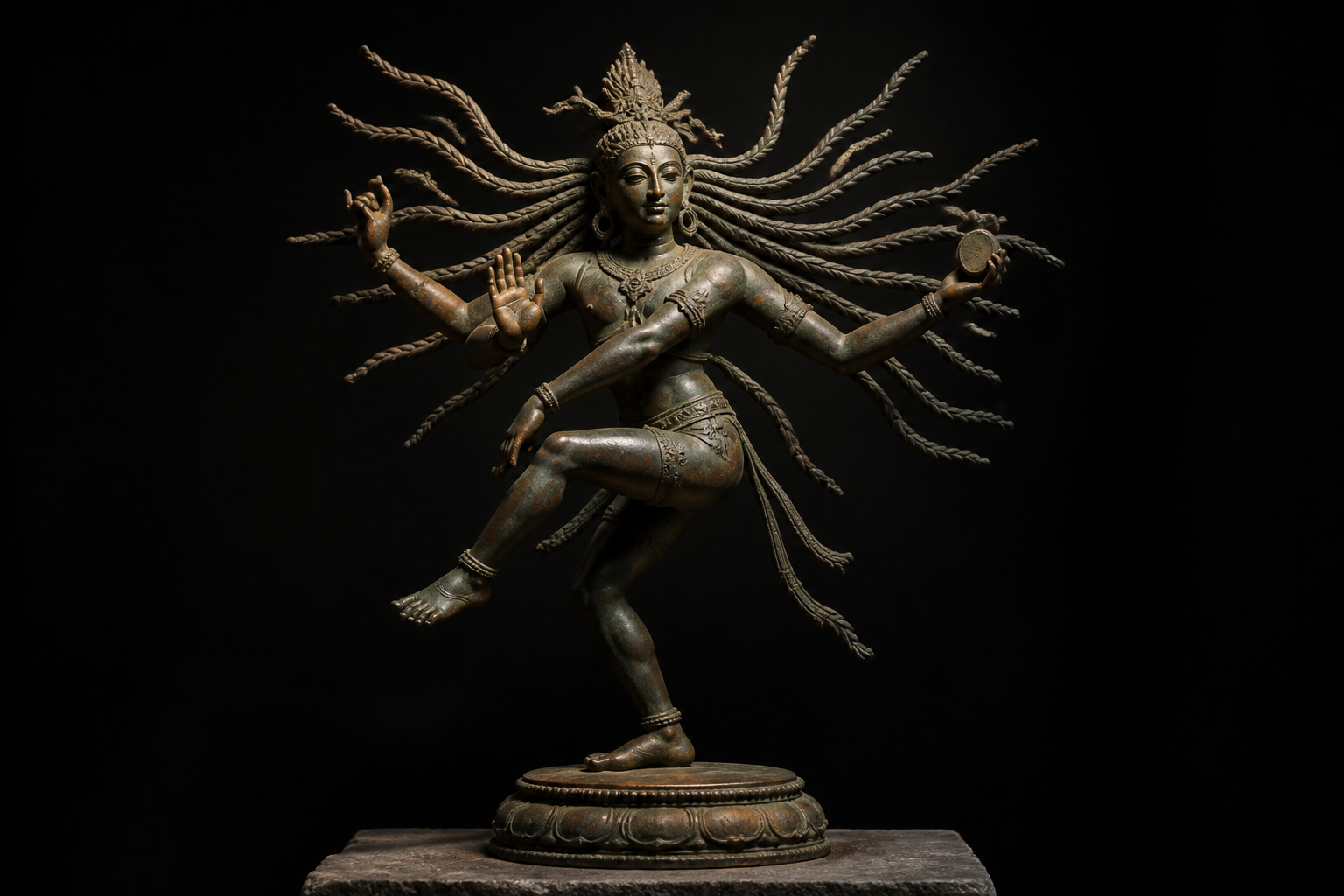 Full bronze figure of dancing Shiva with radiating matted locks echoing the movement of the arms and legs.