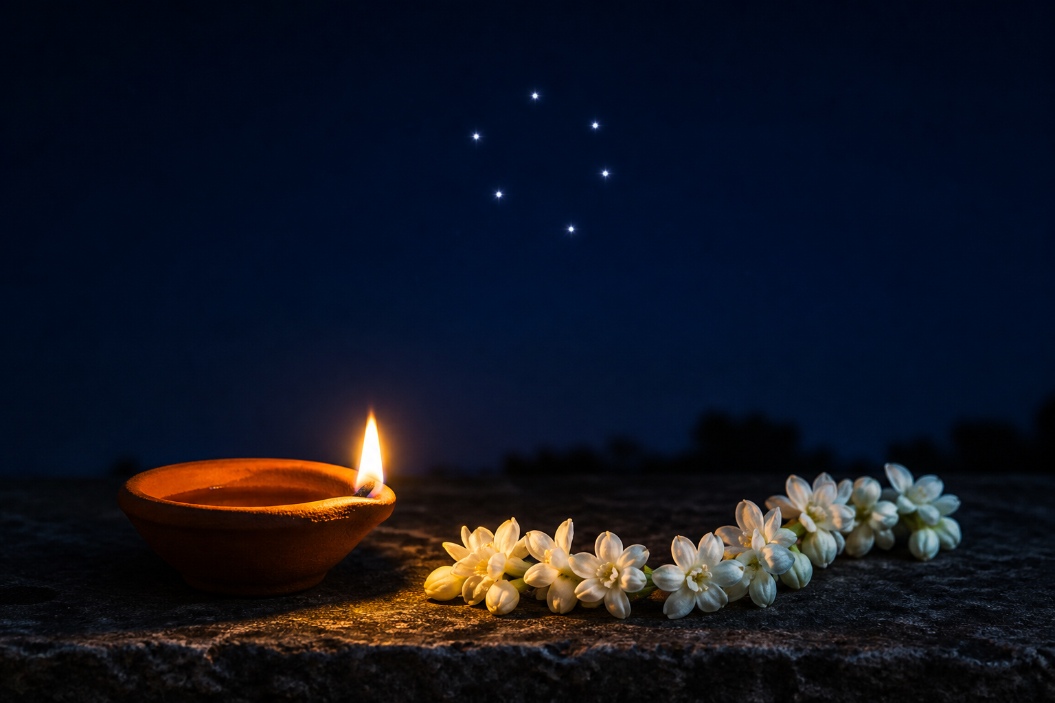 A clay oil lamp and jasmine flowers rest beneath a night sky containing a cluster of six bright stars.