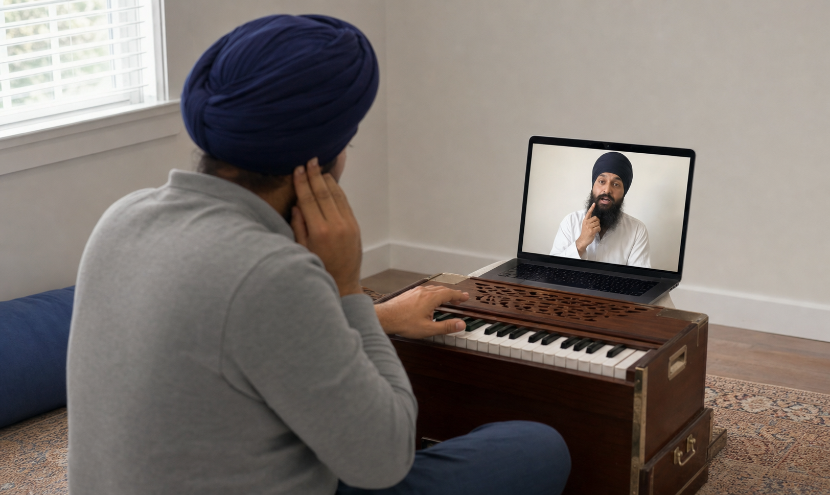 A harmonium student listens attentively as an online teacher demonstrates a correction during a video lesson.