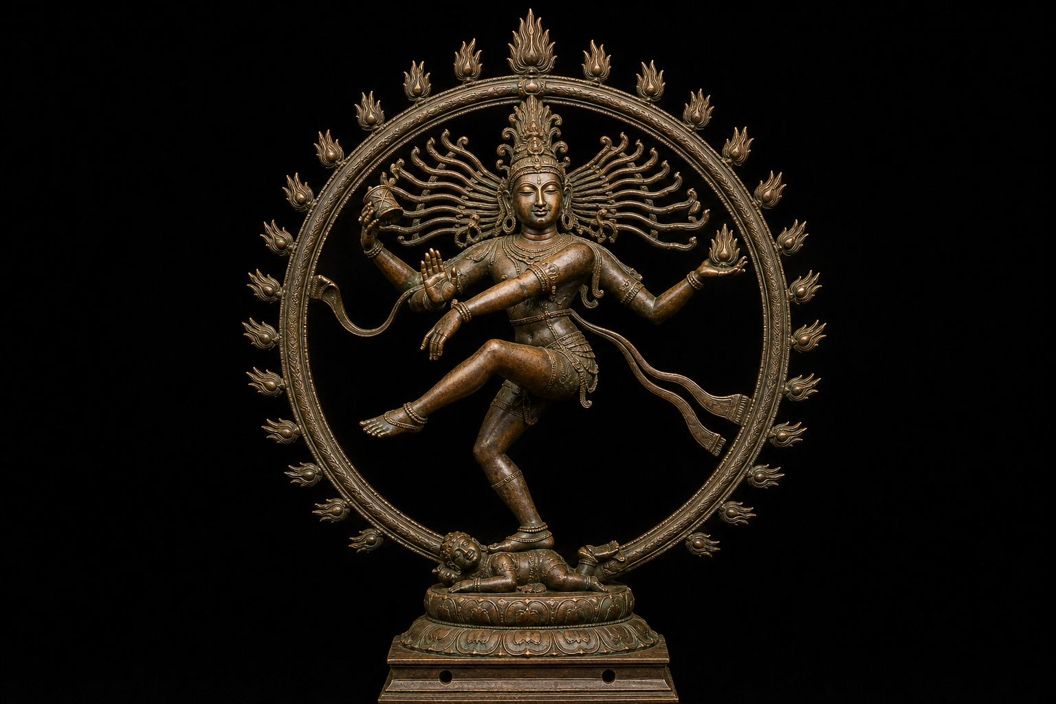 Full bronze-style Nataraja composition in which the spreading locks follow the movement of Shiva's arms and dancing body inside a flame-edged ring.