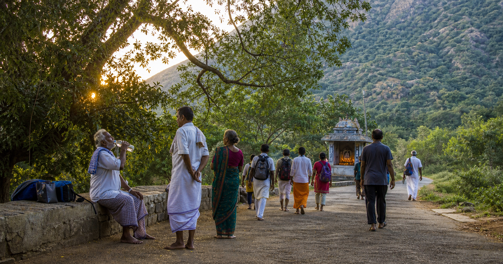 Pilgrims walk slowly around Arunachala at sunrise while an older walker rests and drinks water beside the route.