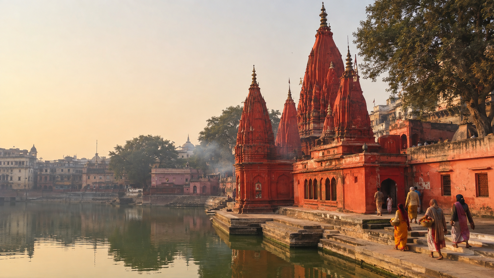 Red temple spires of Maa Kushmanda Devi Temple beside Durga Kund in Varanasi as pilgrims approach at sunrise.
