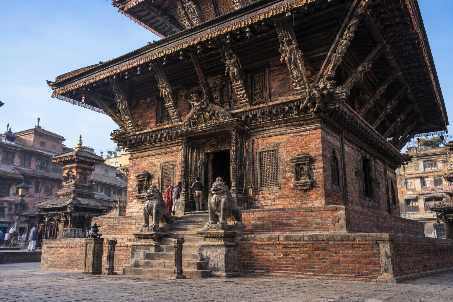 Street-level view of Bhairavnath Temple's brick base, carved wooden facade, deep eaves, and worshippers near the entrance.