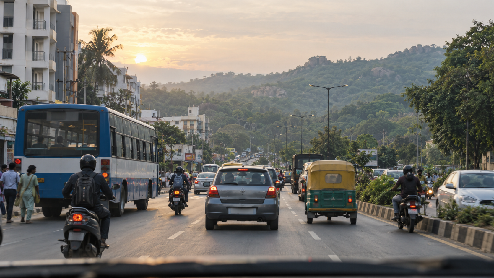 Morning traffic travels along a Bengaluru suburban road toward greener hills in the Bannerghatta direction.